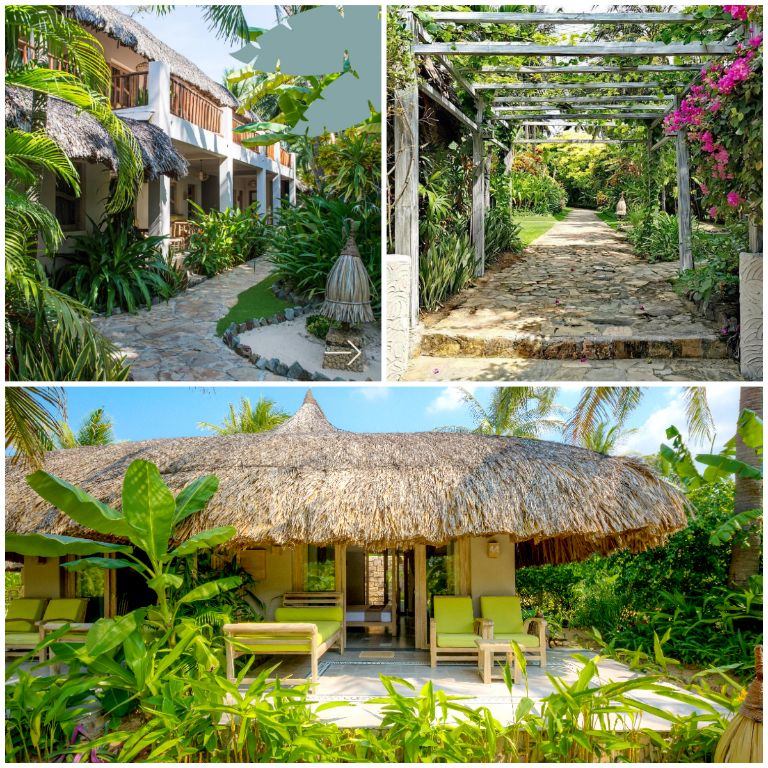 Các căn nhà mái lá được bao bọc bởi khu vườn nhiệt đới xanh mát, mang đến không gian sống trong lành và gần gũi với thiên nhiên. (Nguồn: Internet)