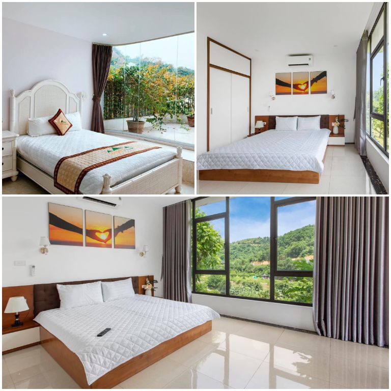 Phòng ngủ có cửa sổ kính lớn với view đồi núi cực chill. 