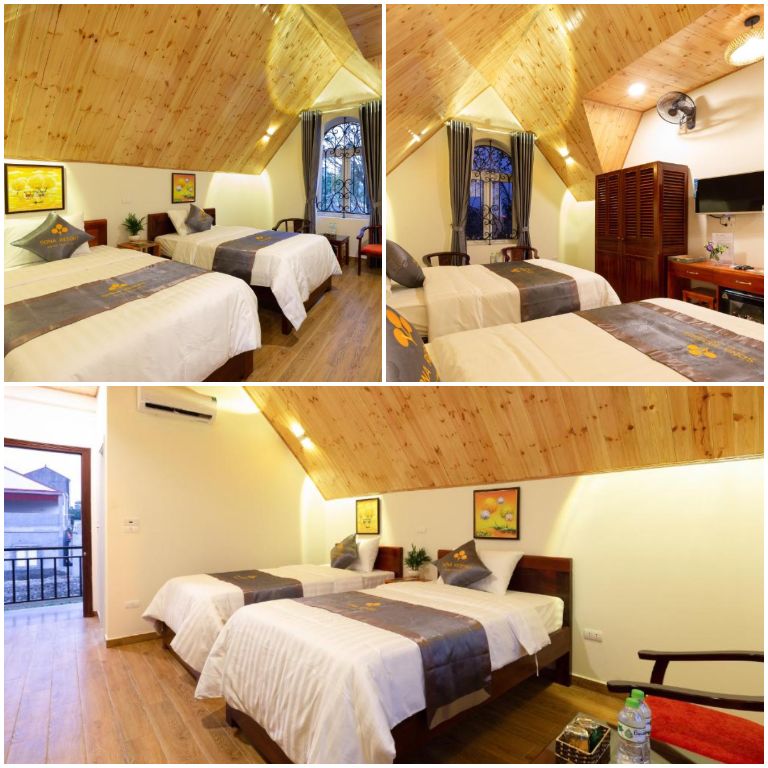 Thiết kế phòng ngủ với gam màu trắng chủ đạo cùng chất liệu gỗ nâu nhạt. (Nguồn: Booking.com) 