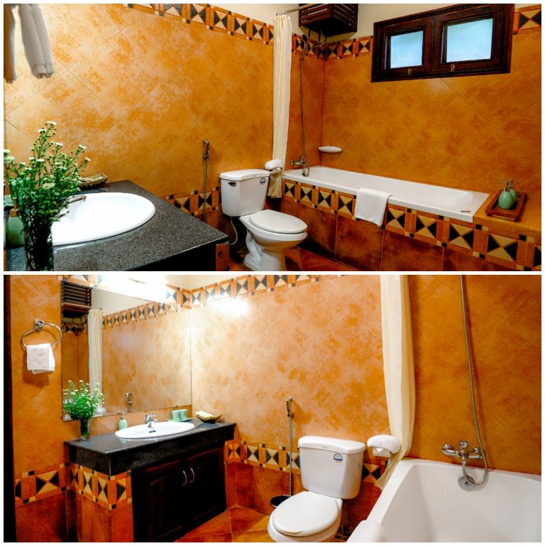 Thiết kế phòng tắm riêng mang tông màu cam cháy chủ đạo, tạo cảm giác hoài cổ, xưa cũ như những năm trong thế kỷ XIX và XX. (Nguồn: Internet)