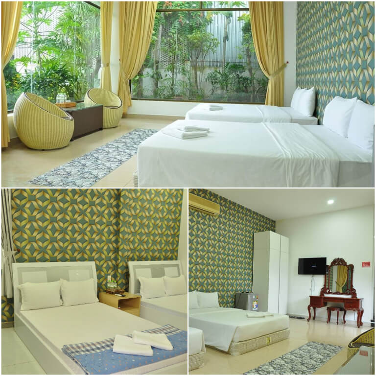 Phòng ngủ rộng và thoáng, kết hợp gam màu sáng từ xanh và trắng.