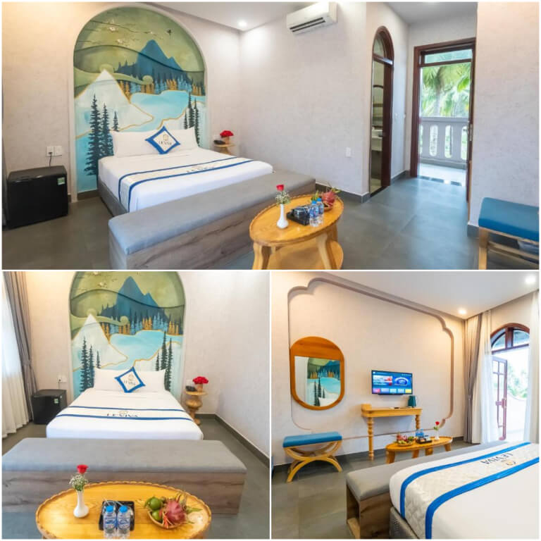 Phòng giường đôi hướng hồ nổi bật với thiết kế tranh vẽ tường độc đáo.