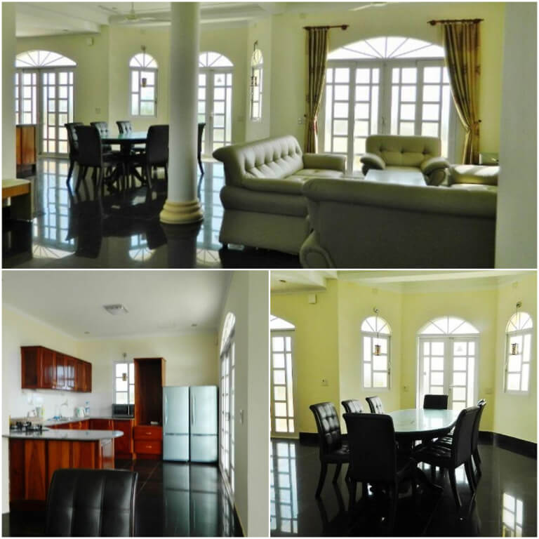 Không gian phòng khách nổi bật với 2 gam màu tương phản trắng và nâu gỗ đen. 